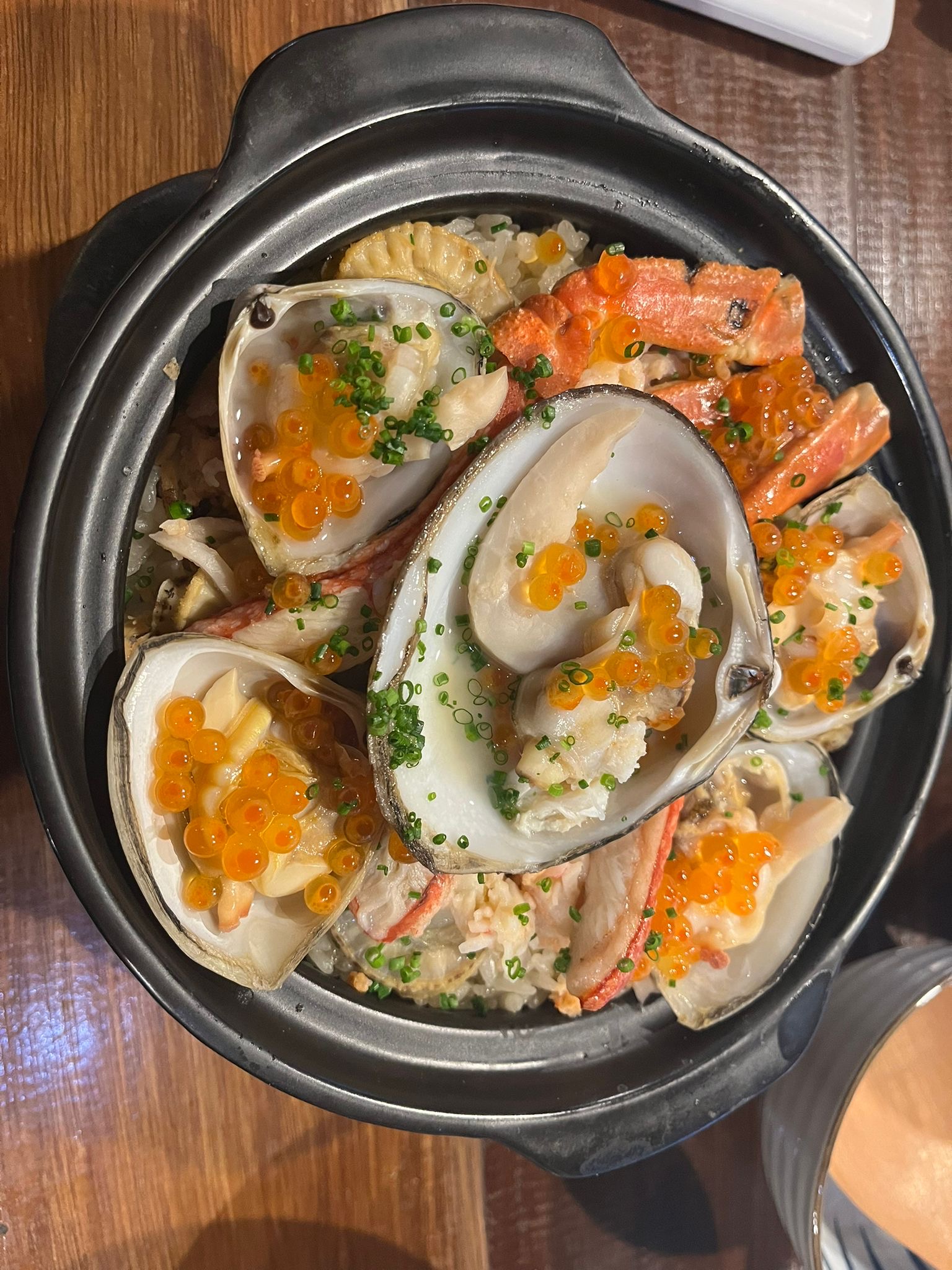 Restaurant claypot dish with Storm Shell clams